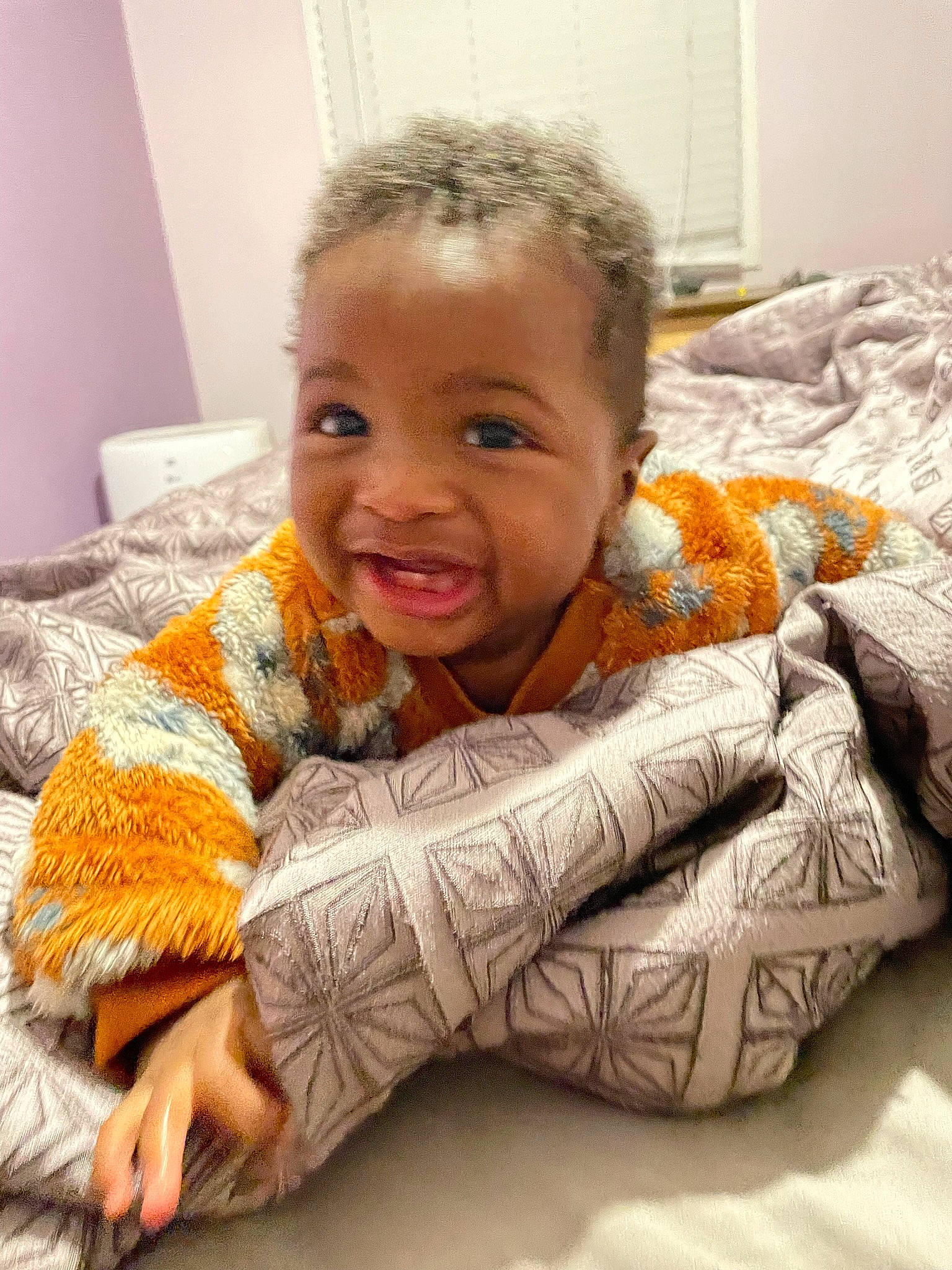 S. Gregory is registered to the contest to win money with this photo: baby, baby_toddler_clothing, bedding, child, comfort, couch, eye, flooring, fun, happy, linens, mouth, nose, person, room, sitting, skin, sleeve, smile, thumb
