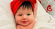 Emmarie Grace is registered to the contest to win money with this photo: baby, blanket, cute, cuteness, face, hair, hand, happy, headband, heart, infant, kiss, love, newspaper_background, portrait, red_bow, red_text, skin, smile, text