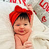 Emmarie Grace is registered to the contest to win money with this photo: baby, blanket, cute, cuteness, face, hair, hand, happy, headband, heart, infant, kiss, love, newspaper_background, portrait, red_bow, red_text, skin, smile, text