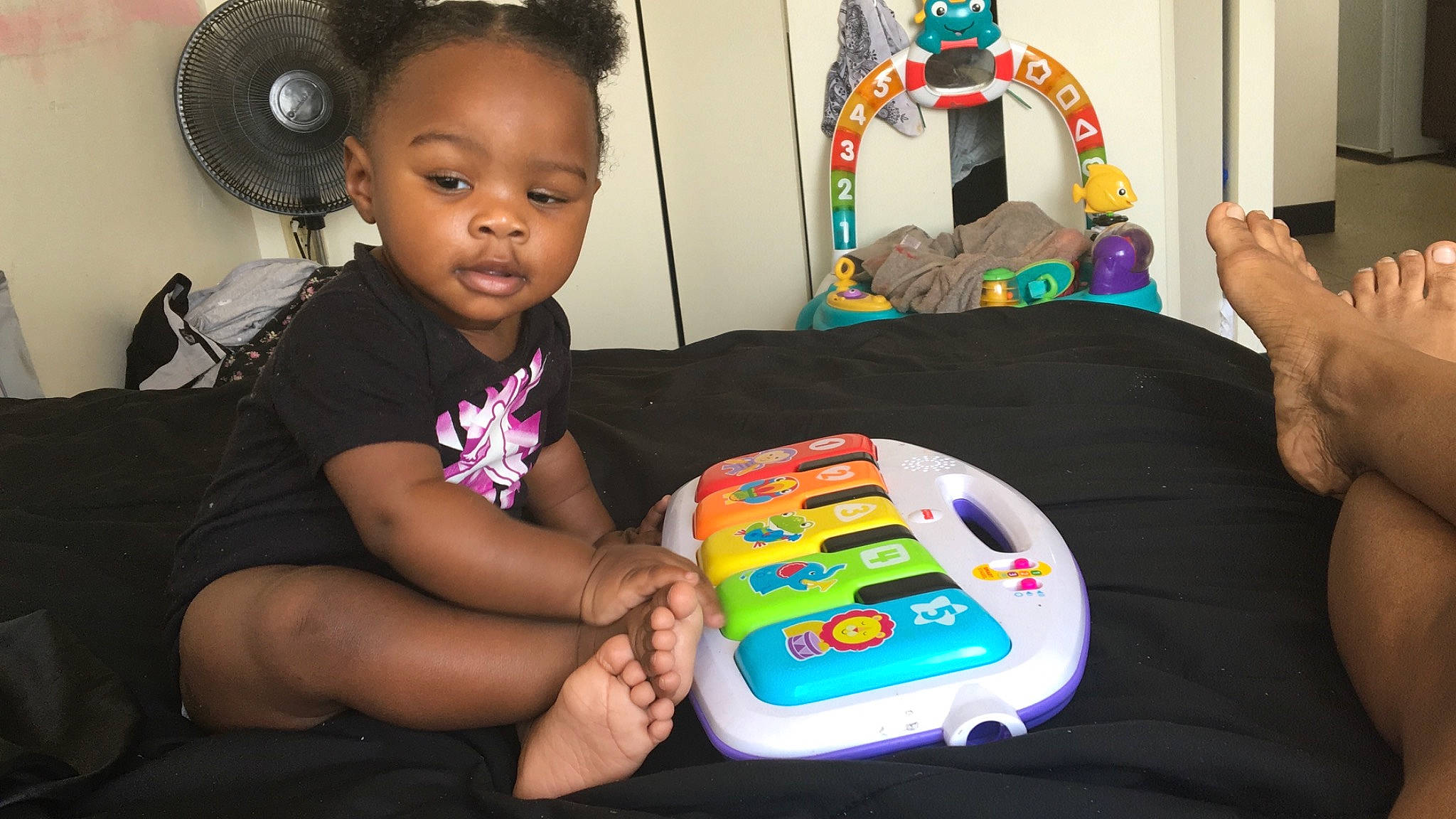 Jayvonna joined the competition — help win amazing prizes! audio_equipment, chair, child, circle, event, fun, gadget, hand, headphones, hearing, person, play, recreation, room, sharing, sitting, t_shirt, table, toddler, toy