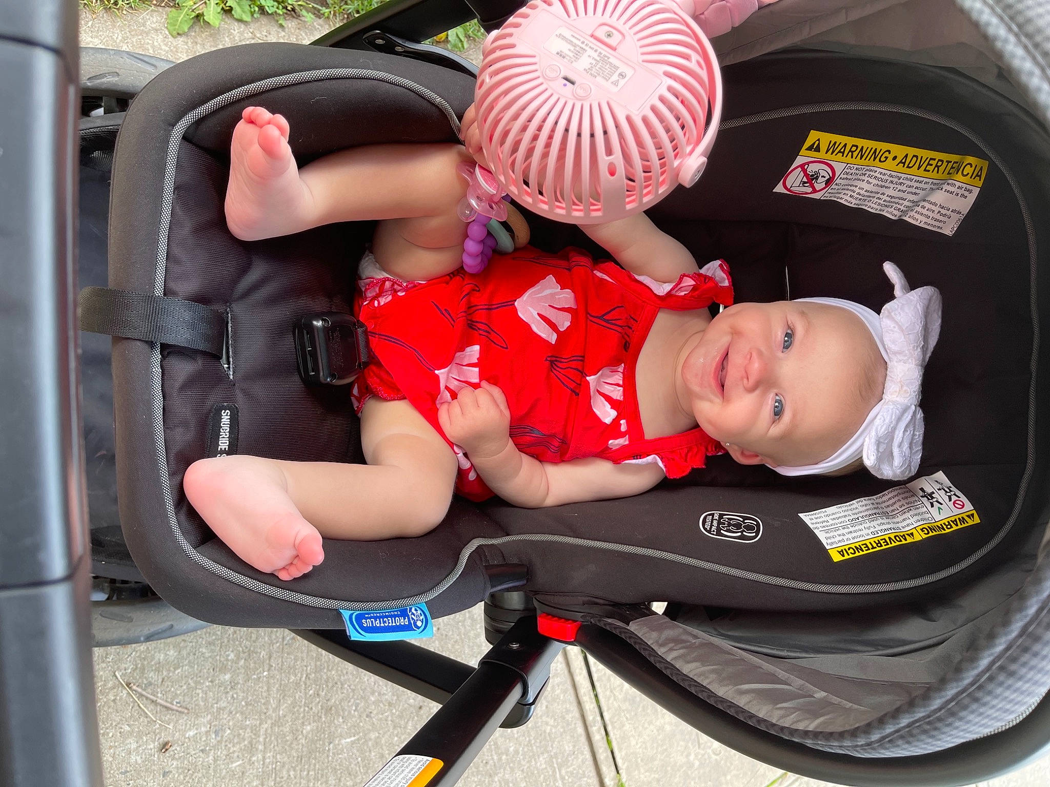 Brielle joined the competition — help win amazing prizes! automotive_design, baby, baby_carriage, bag, bicycle_helmet, car_seat, hand, helmet, human_body, joy, lap, leg, luggage_and_bags, motor_vehicle, person, plant, shorts, tire, toddler, vehicle