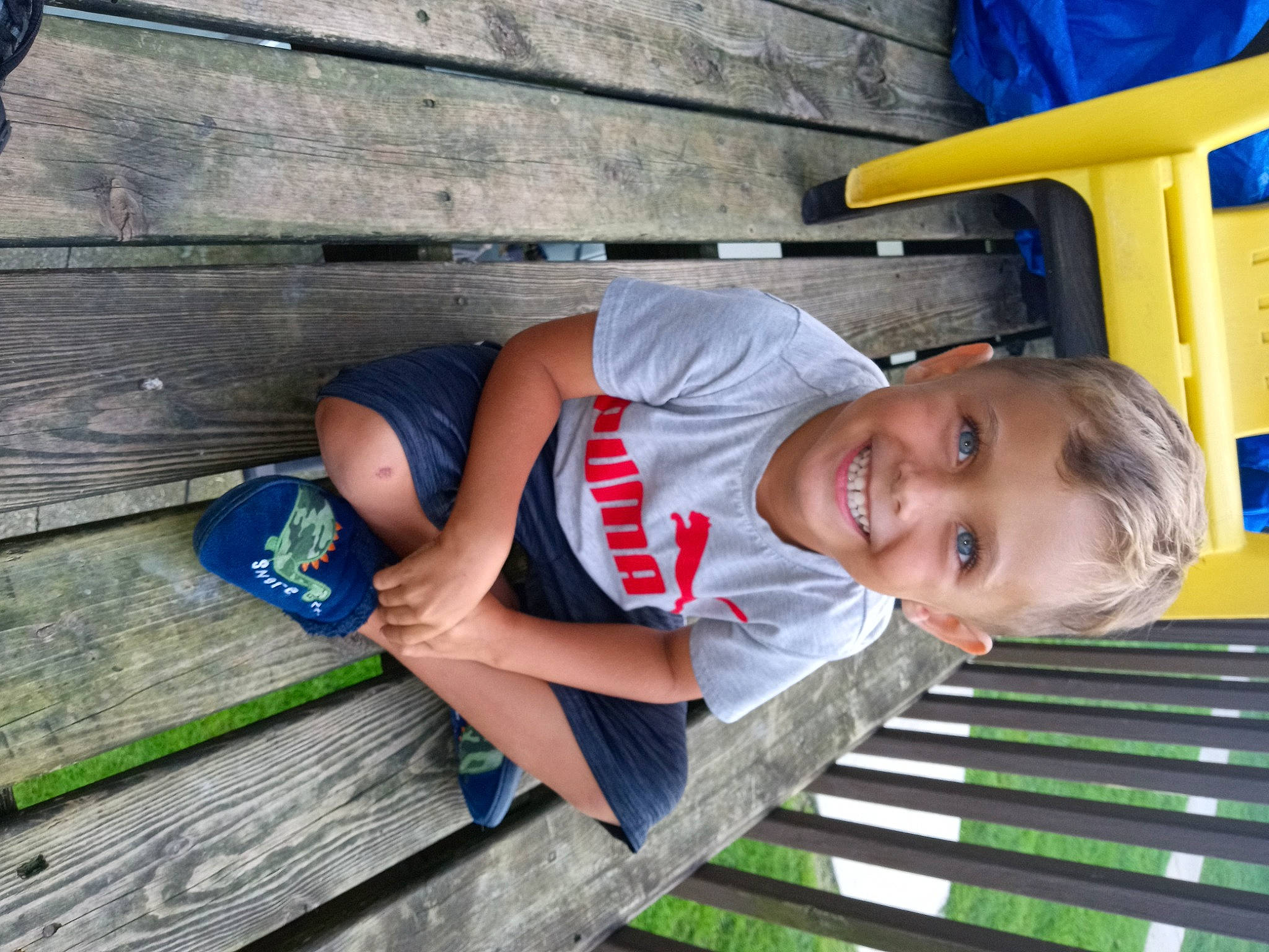 Ellis joined the competition — help win amazing prizes! blue, child, electric_blue, fun, grass, happy, human_leg, joy, leisure, person, recreation, shorts, slipper, smile, t_shirt, toddler, travel, vacation, wood