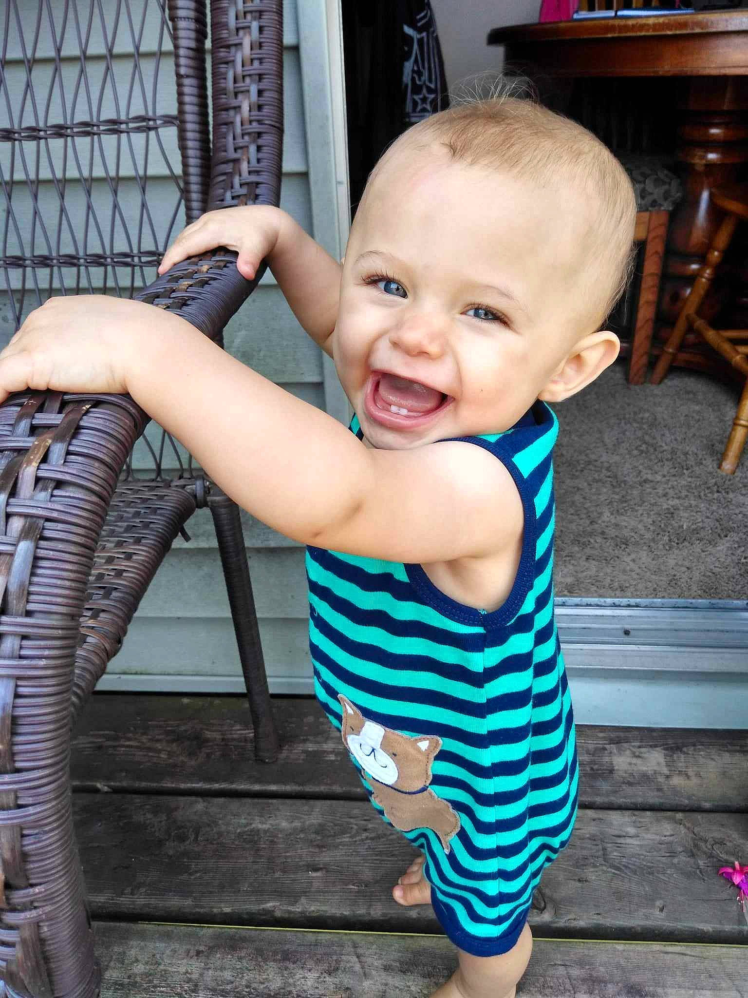 Ellis is registered to the contest to win money with this photo: baby_toddler_clothing, chair, cool, face, facial_expression, flash_photography, flooring, fun, hairstyle, hand, happy, head, human, joint, leg, person, shoulder, skin, smile, standing