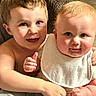 Walker is registered to the contest to win money with this photo: child, baby, toddler, couch, bib, smile, face, skin, hair, happy, indoor, closeup, family, sitting, cuddling, portrait, young, cute, light, expression