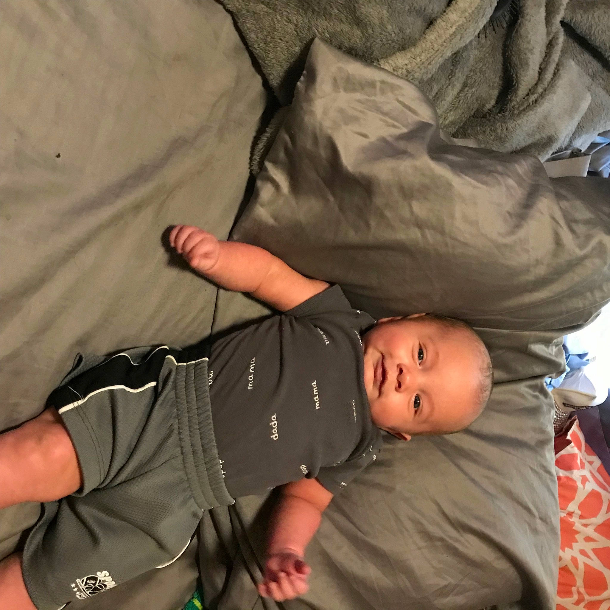 Kyler is registered to the contest to win money with this photo: abdomen, baby, baby_carriage, baby_products, baby_toddler_clothing, cheek, child, comfort, elbow, finger, fun, gesture, hat, human_body, leg, person, sitting, sleeve, smile, thigh