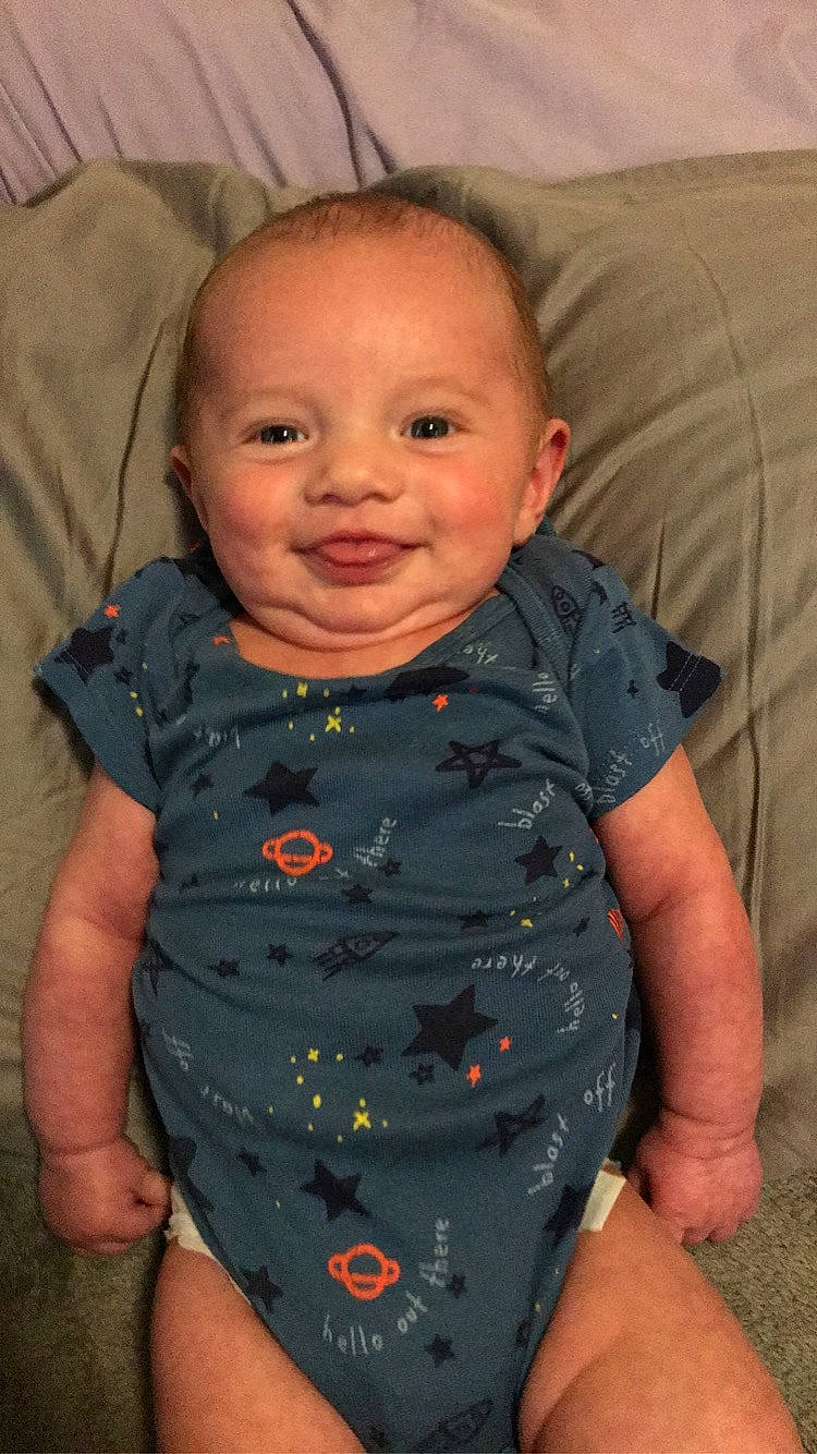 Kyler is registered to the contest to win money with this photo: baby_toddler_clothing, cheek, chin, comfort, eye, eyebrow, face, forehead, hair, head, human_body, iris, joy, lip, mouth, neck, nose, person, product, skin