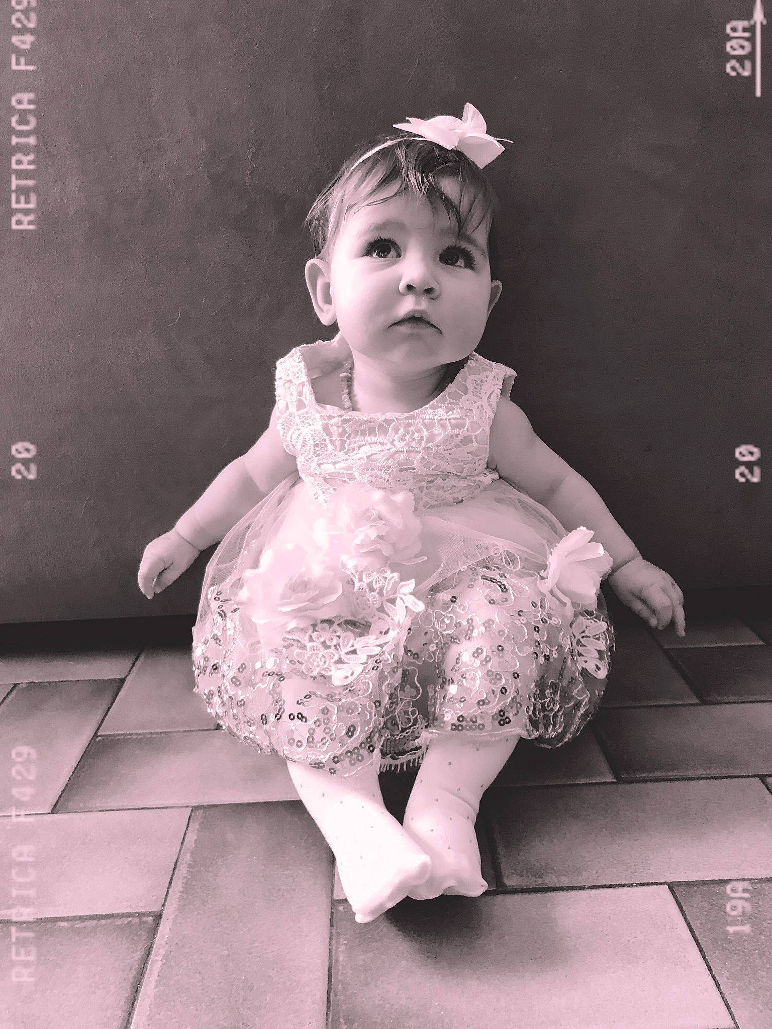 Liselya participe au concours pour gagner de l'argent avec cette photo : art, baby, baby_toddler_clothing, black_and_white, bridal_accessory, embellishment, flash_photography, happy, headpiece, human_leg, iris, jewellery, monochrome, monochrome_photography, person, pink, sleeve, standing, style, toddler