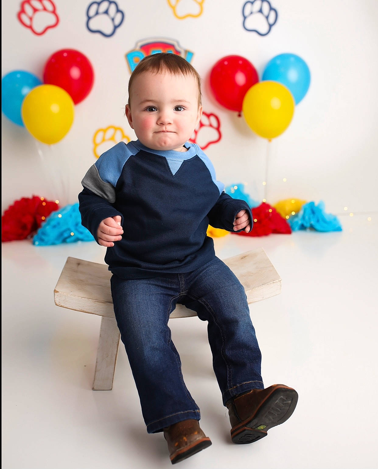 Conrad is registered to the contest to win money with this photo: baby_toddler_clothing, balloon, child, electric_blue, event, facial_expression, fun, gesture, happy, leg, organ, party_supply, person, photograph, product, sleeve, smile, standing, t_shirt, toddler