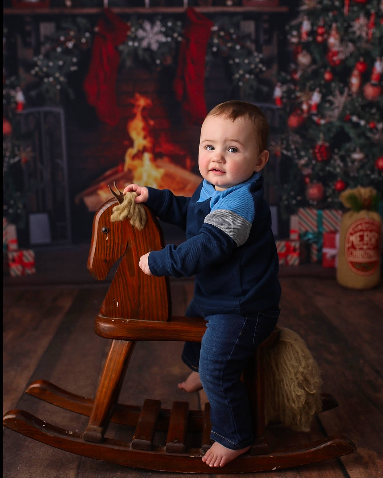 Conrad is registered to the contest to win money with this photo: baby, chair, child, christmas, christmas_eve, event, flooring, fun, happy, heat, holiday, lap, orange, person, picture_frame, room, sitting, stool, toddler, tradition