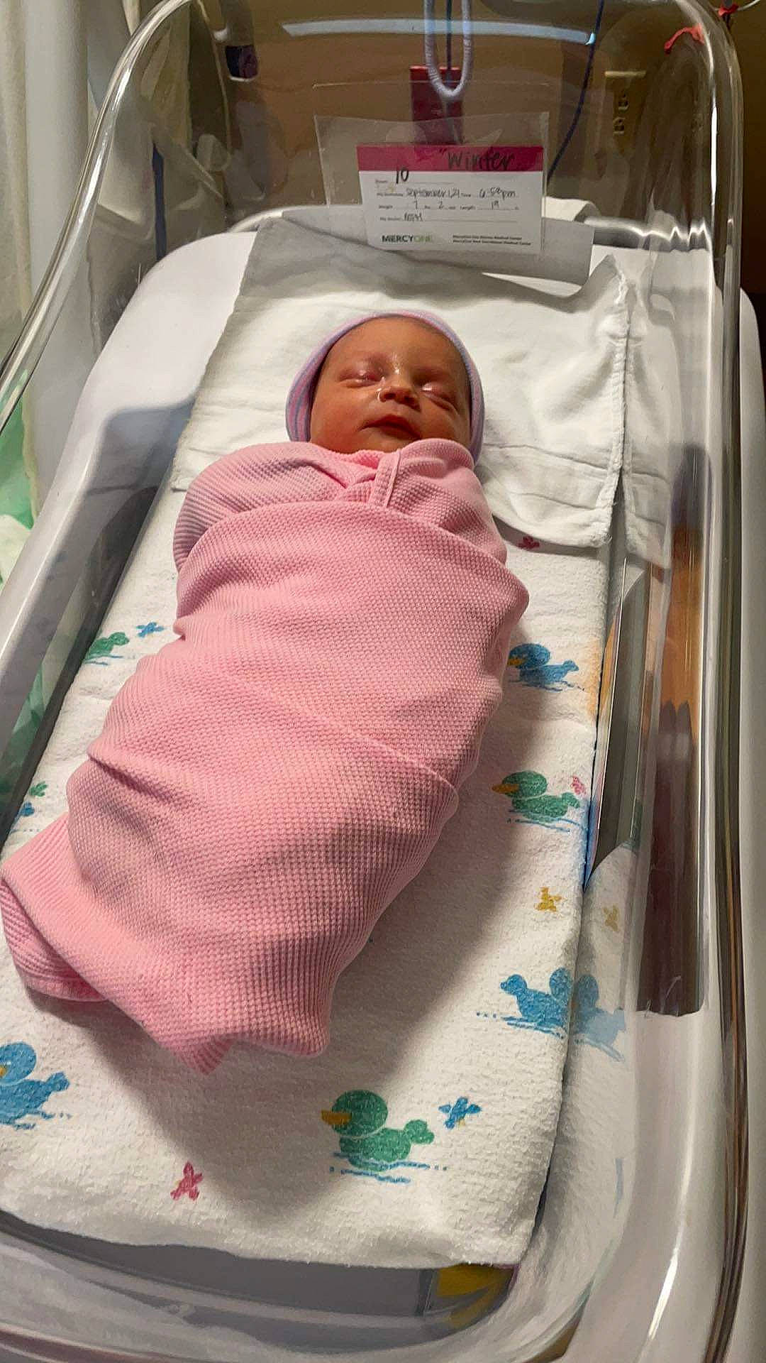 Winter is registered to the contest to win money with this photo: baby, baby_products, baby_safety, baby_toddler_clothing, bed, bedding, bedtime, child, comfort, cradle, face, head, hospital, infant_bed, linens, nap, person, product, room, sleep