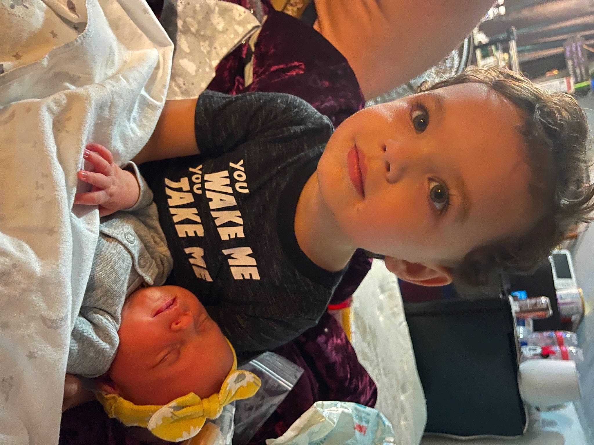 Winter is registered to the contest to win money with this photo: baby, cheek, child, comfort, elbow, eyelash, fun, happy, mouth, person, room, sitting, sleeve, t_shirt, toddler