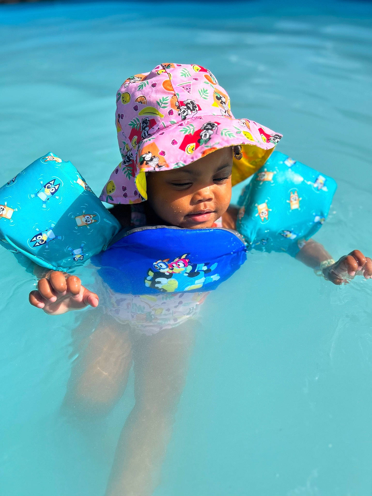 Harley joined the competition — help win amazing prizes! aqua, azure, baby_toddler_clothing, beach, blue, cap, child, electric_blue, fashion_accessory, fun, happy, hat, headgear, headwear, leisure, people_on_beach, person, personal_protective_equipment, recreation, toddler
