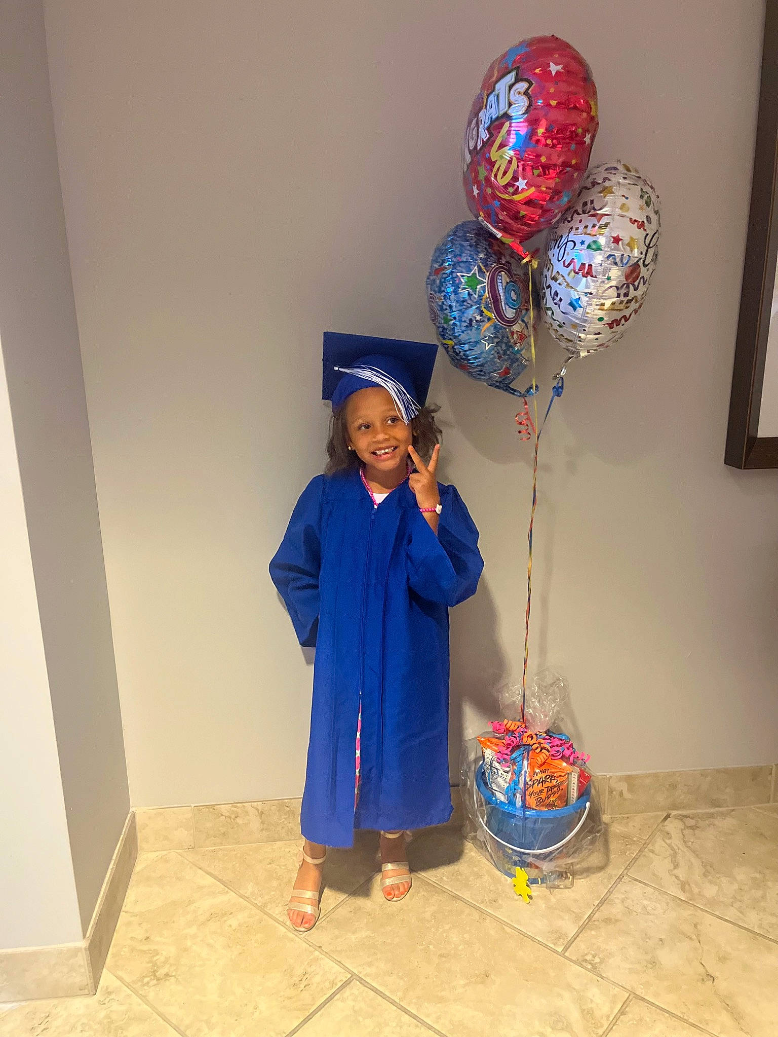 Harley joined the competition — help win amazing prizes! art, balloon, child, costume, electric_blue, event, fashion_accessory, flooring, fun, glass, headgear, headwear, joy, light_fixture, magenta, party_supply, person, picture_frame, room, smile