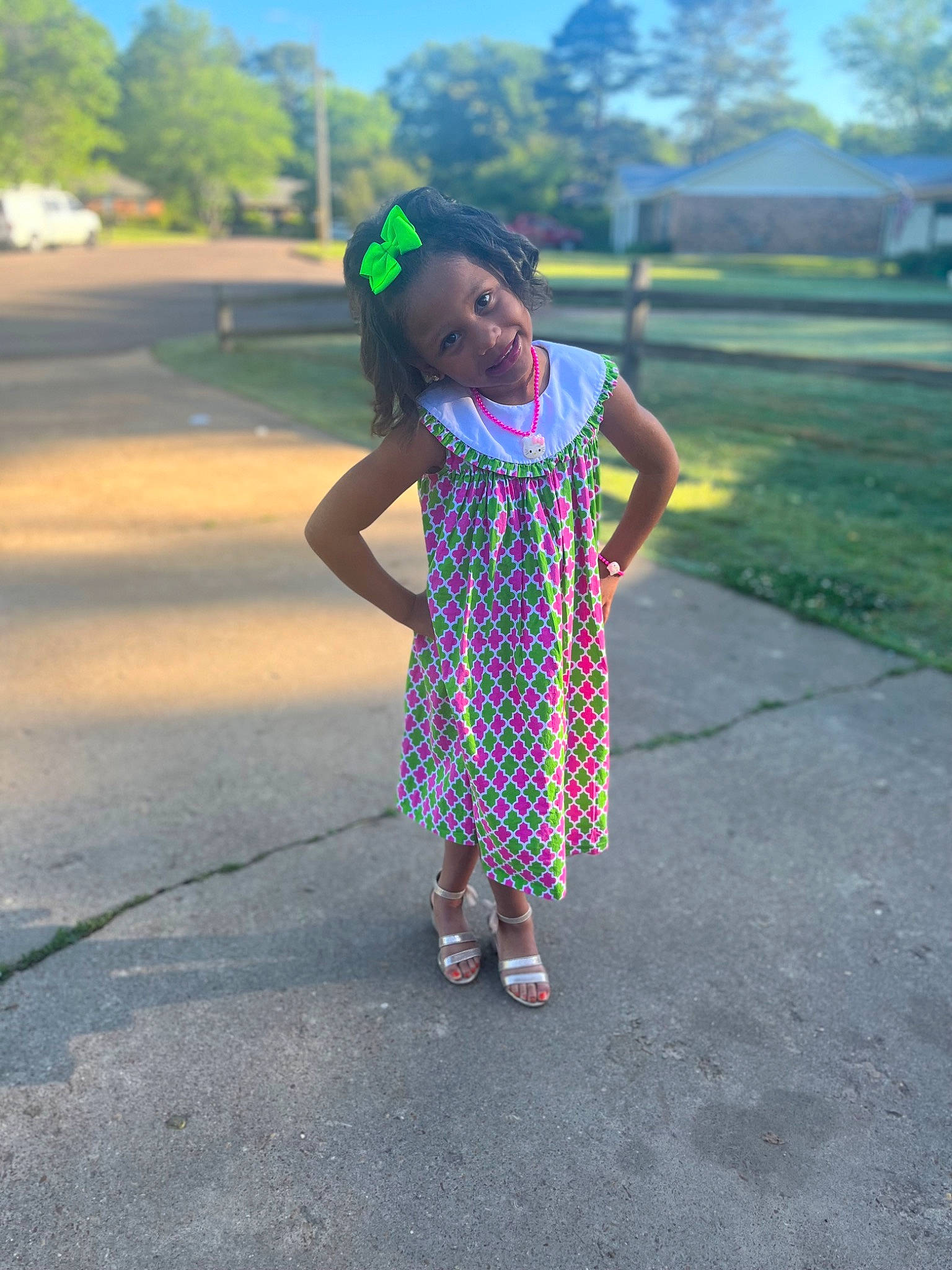 Harley is registered to the contest to win money with this photo: asphalt, fun, grass, grassland, hand, happy, joy, leisure, magenta, pattern, people_in_nature, person, plaid, plant, recreation, road_surface, sky, sleeve, tints_and_shades, toddler