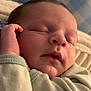 Jacob is registered to the contest to win money with this photo: baby, bed, blanket, bodypart, clothing, face, finger, furniture, hand, head, knitwear, newborn, person, photography, portrait, quilt, sleeping, sweater, sweatshirt, towel