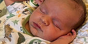 Jacob is registered to the contest to win money with this photo: baby, bed, bedroom, blanket, bodypart, cushion, face, finger, furniture, hand, head, homedecor, indoors, newborn, person, photography, portrait, quilt, room, sleeping