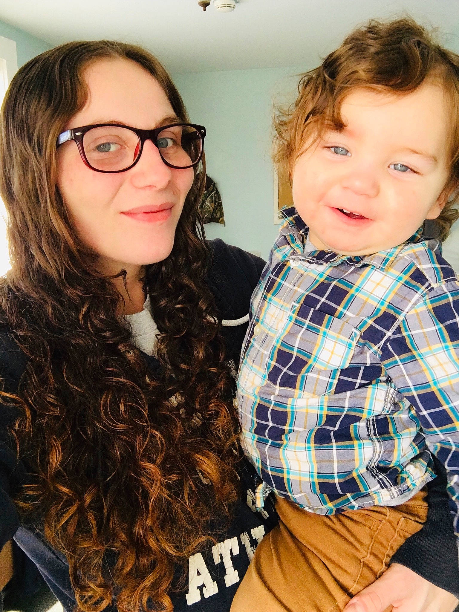 Corbyn is registered to the contest to win money with this photo: brown_hair, child, cool, design, eye, eyewear, face, glasses, hair, hairstyle, head, joy, lip, long_hair, outerwear, pattern, person, photography, plaid, smile