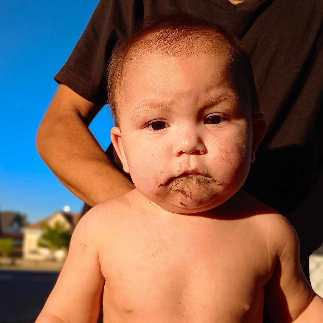 Elijah is registered to the contest to win money with this photo: baby, back, beard, bodypart, clothing, face, finger, frown, hand, happy, head, mouth, newborn, person, photography, portrait, sad, shorts, smile, t_shirt