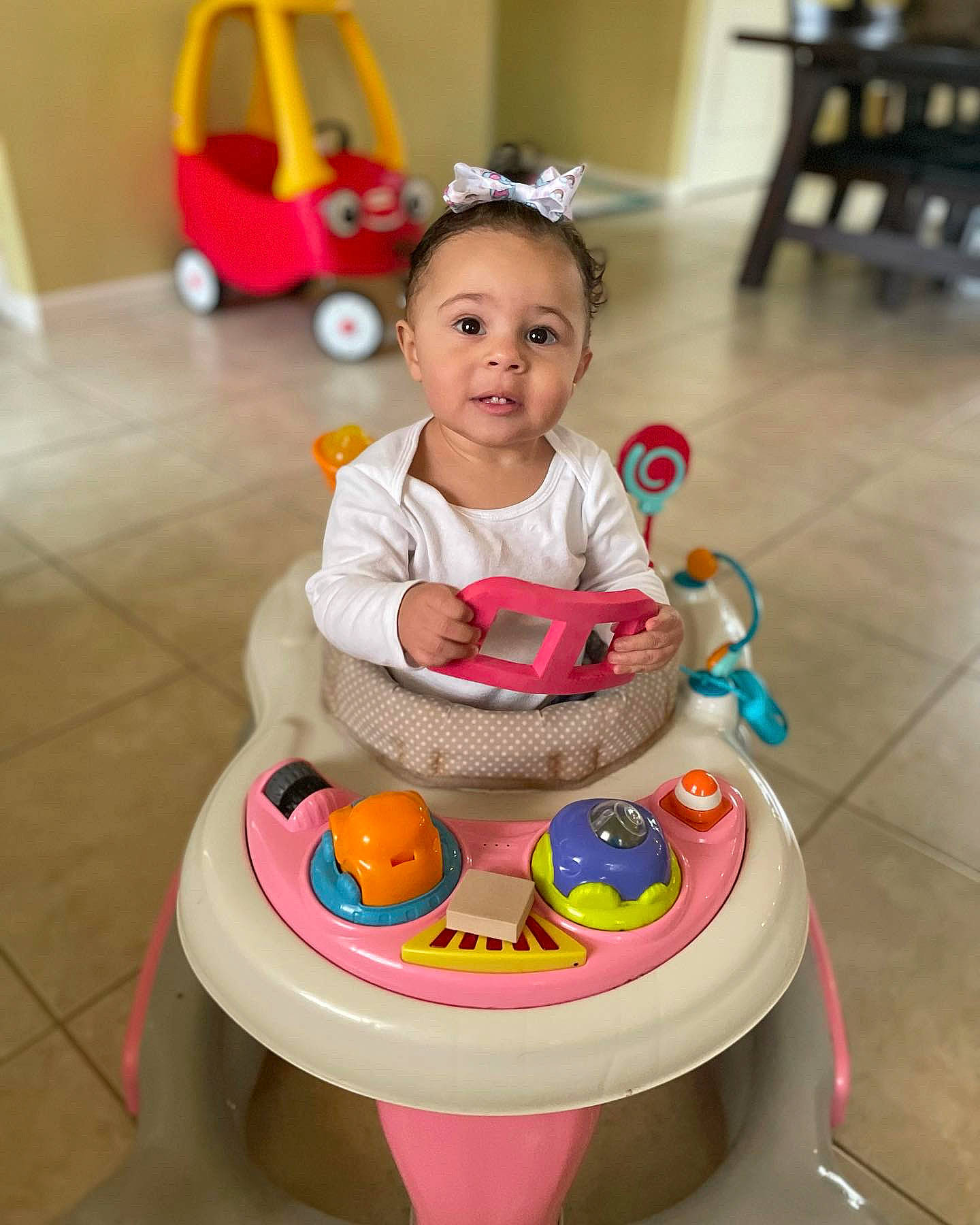 Kamaya joined the competition — help win amazing prizes! baby, baby_playing_with_toys, baby_products, child, face, facial_expression, floor, flooring, hairstyle, head, human_body, leisure, person, photograph, riding_toy, snapshot, tire, toddler, toy, wheel