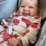 baby, infant, smiling, car_seat, onesie, heart_pattern, pacifier, clip, hand, face, cheeks, happy, cute, child, clothing, fabric, seat, indoor, portrait, closeup