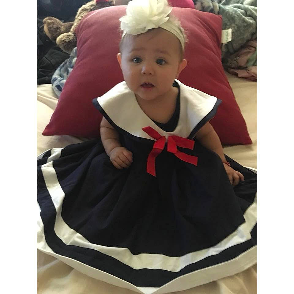 Everly Rose joined the competition — help win amazing prizes! baby, baby_products, child, clothing, costume, dress, ear, head, headgear, hood, maroon, outerwear, pattern, person, product, surprise, toddler