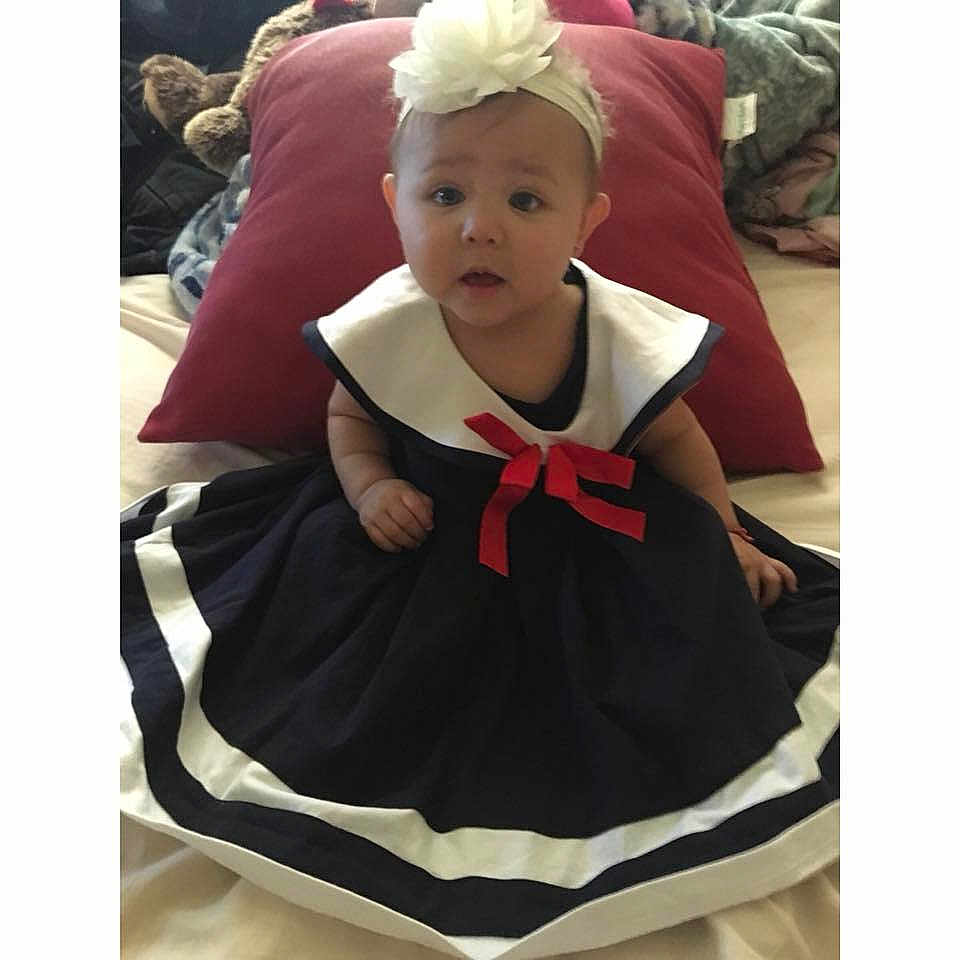 Everly Rose joined the competition — help win amazing prizes! baby, baby_products, child, clothing, costume, dress, ear, head, headgear, hood, maroon, outerwear, pattern, person, product, surprise, toddler