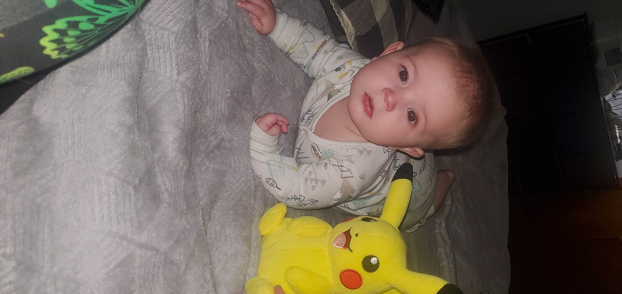 Tate is registered to the contest to win money with this photo: baby, baby_products, baby_toddler_clothing, cheek, child, comfort, facial_expression, fun, gesture, green, human_body, iris, mouth, nose, person, product, skin, sleeve, textile, toddler