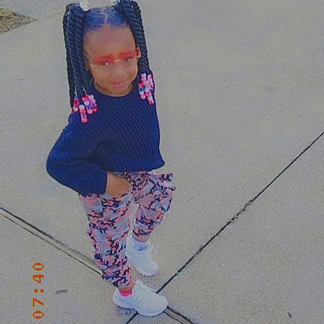 Sumer is registered to the contest to win money with this photo: child, city, clothing, costume, face, female, footwear, girl, glove, head, outdoors, pants, path, person, photography, portrait, shoe, sidewalk, sneaker, walking