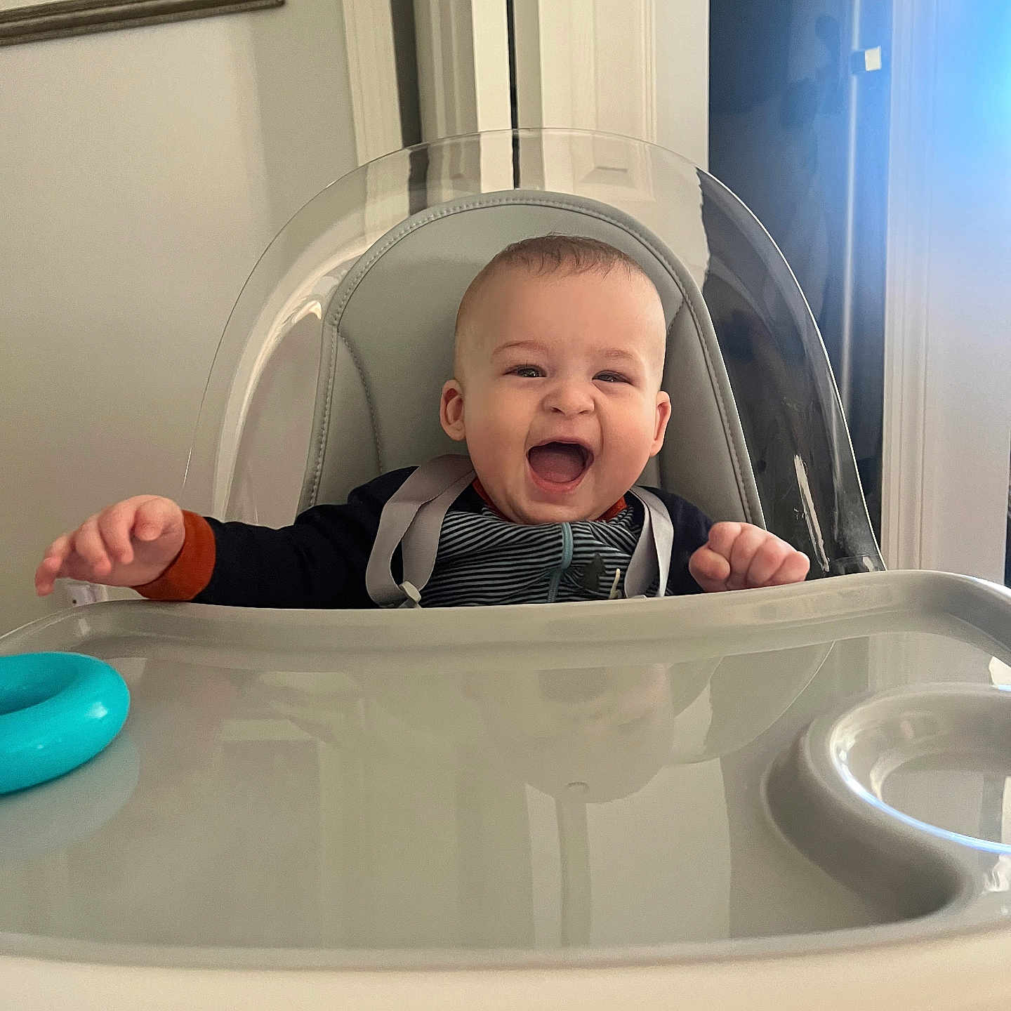 Azariah is registered to the contest to win money with this photo: accessories, baby, babylaughing, bathing, bodypart, chair, cutlery, face, finger, furniture, hand, happy, head, jewelry, laughing, necklace, person, photography, playarea, portrait