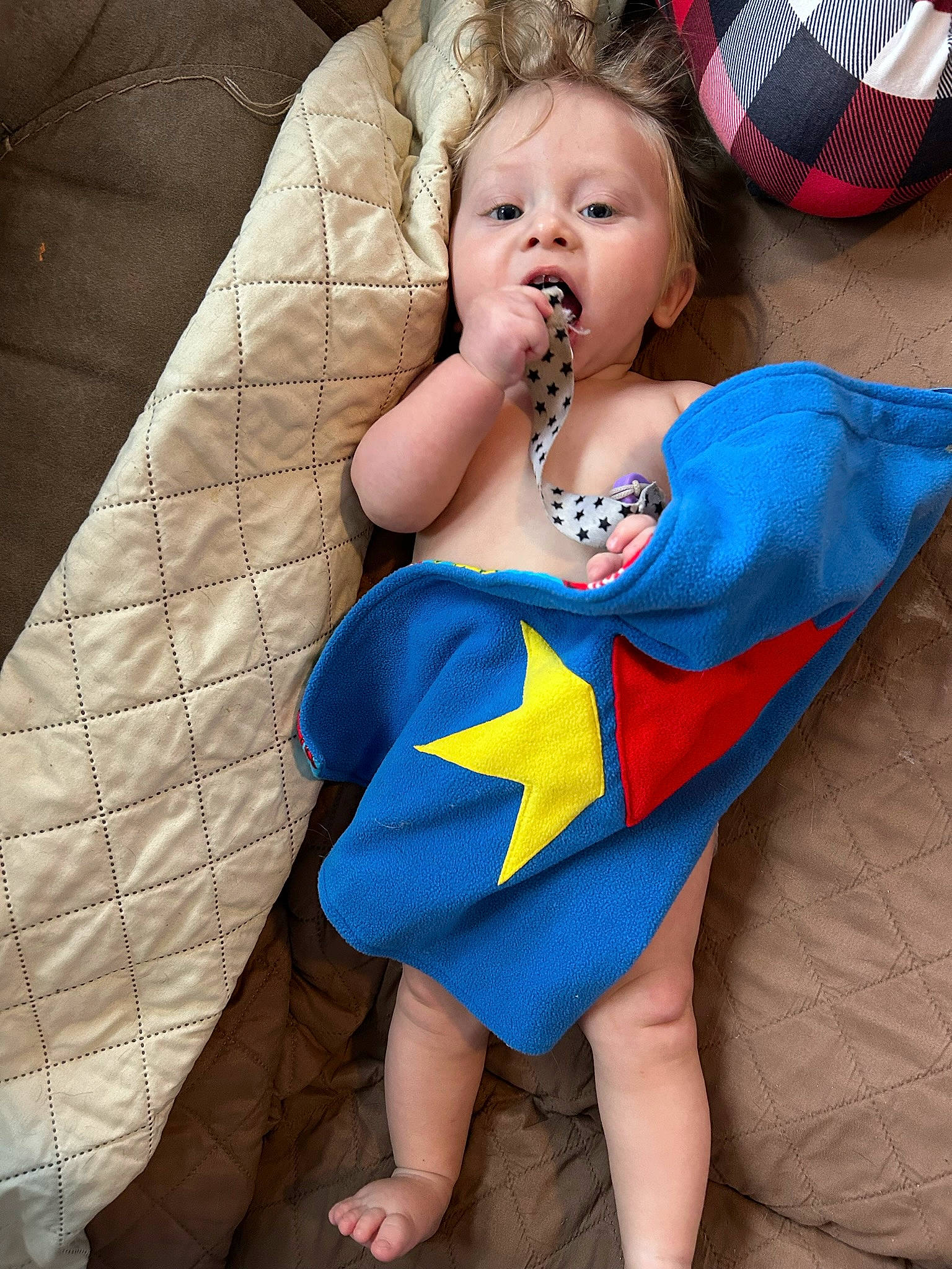 Jace is registered to the contest to win money with this photo: abdomen, baby, baby_toddler_clothing, chair, child, comfort, electric_blue, eye, face, happy, head, human_leg, knee, leg, mouth, neck, person, textile, thigh, toddler