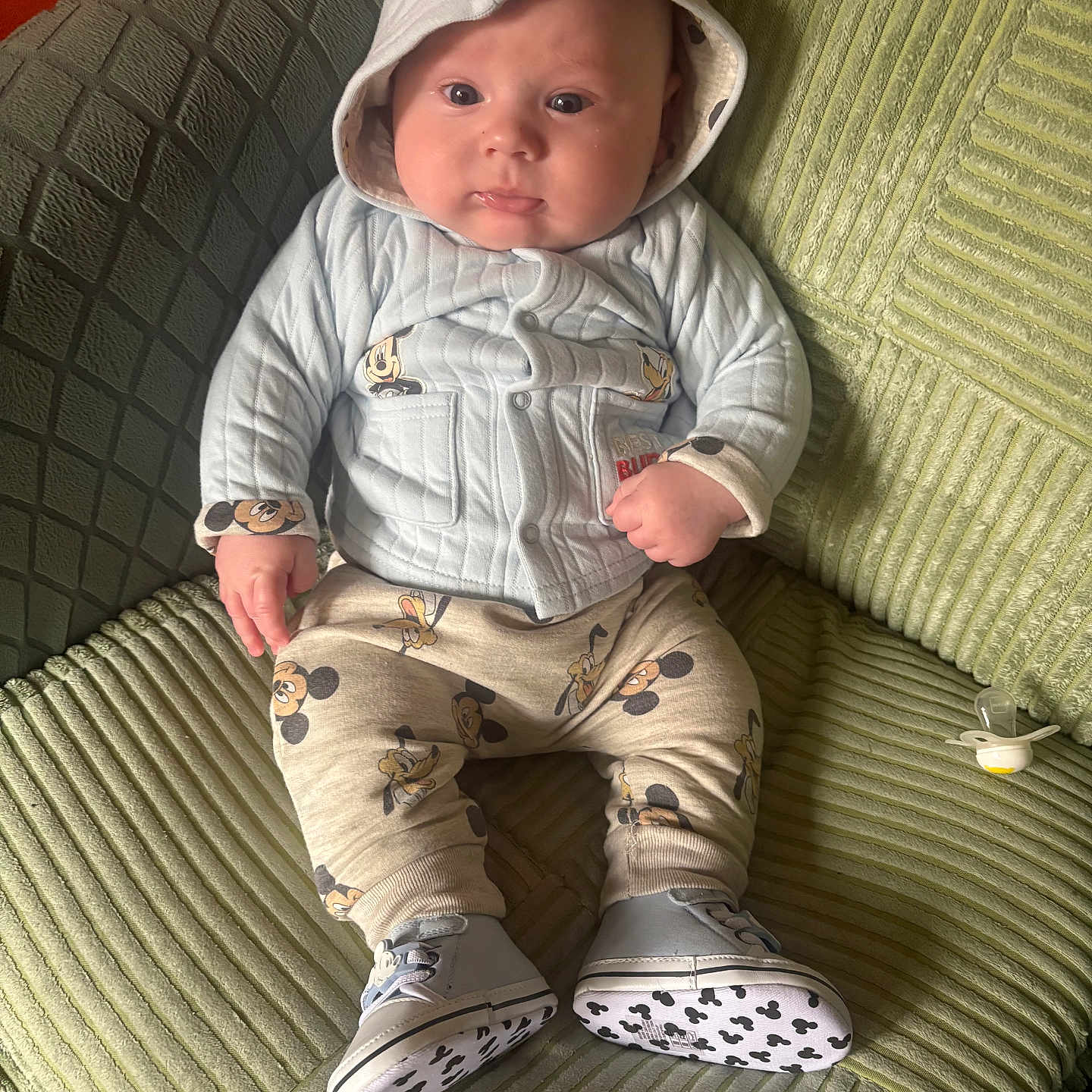 Ethan joined the competition — help win amazing prizes! baby, bonnet, cap, chair, clothing, couch, face, footwear, furniture, hat, head, hood, hoodie, knitwear, pants, person, shoe, sitting, sweater, sweatshirt