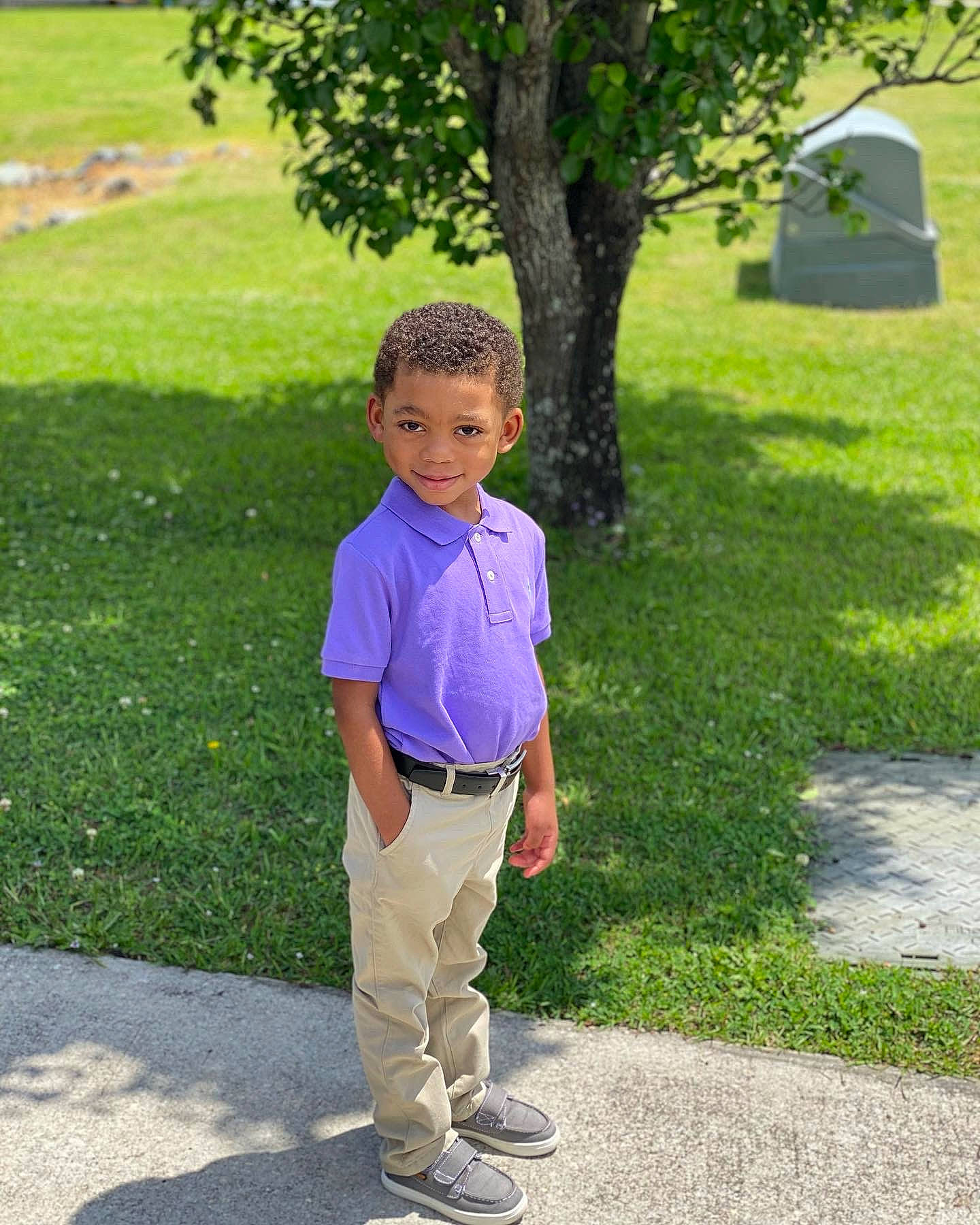 Kenneth is registered to the contest to win money with this photo: asphalt, eye, footwear, grass, hair, happy, head, human_body, joy, leg, leisure, people_in_nature, person, plant, public_space, recreation, road_surface, shrub, standing, summer