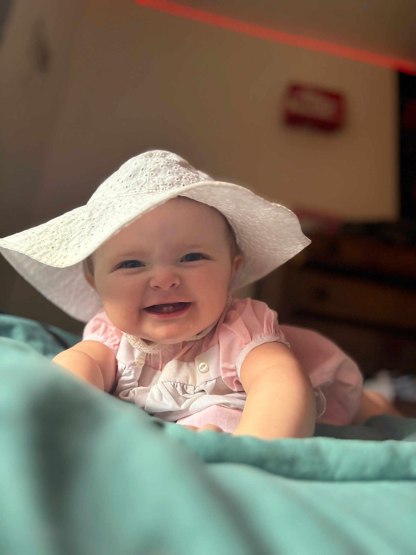 Esmaee is registered to the contest to win money with this photo: baby, child, smiling, hat, pink_clothing, blanket, indoor, portrait, cute, happy, face, infant, young_child, soft_lighting, closeup, baby_girl, skin, person, apparel, headwear