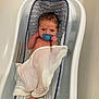 newborn, baby, bathtub, pacifier, bath, infant, white_cloth, wet_hair, baby_bath_seat, bathroom, foot, hand, skin, water, relaxing, cute, indoors, baby_care, child, portrait