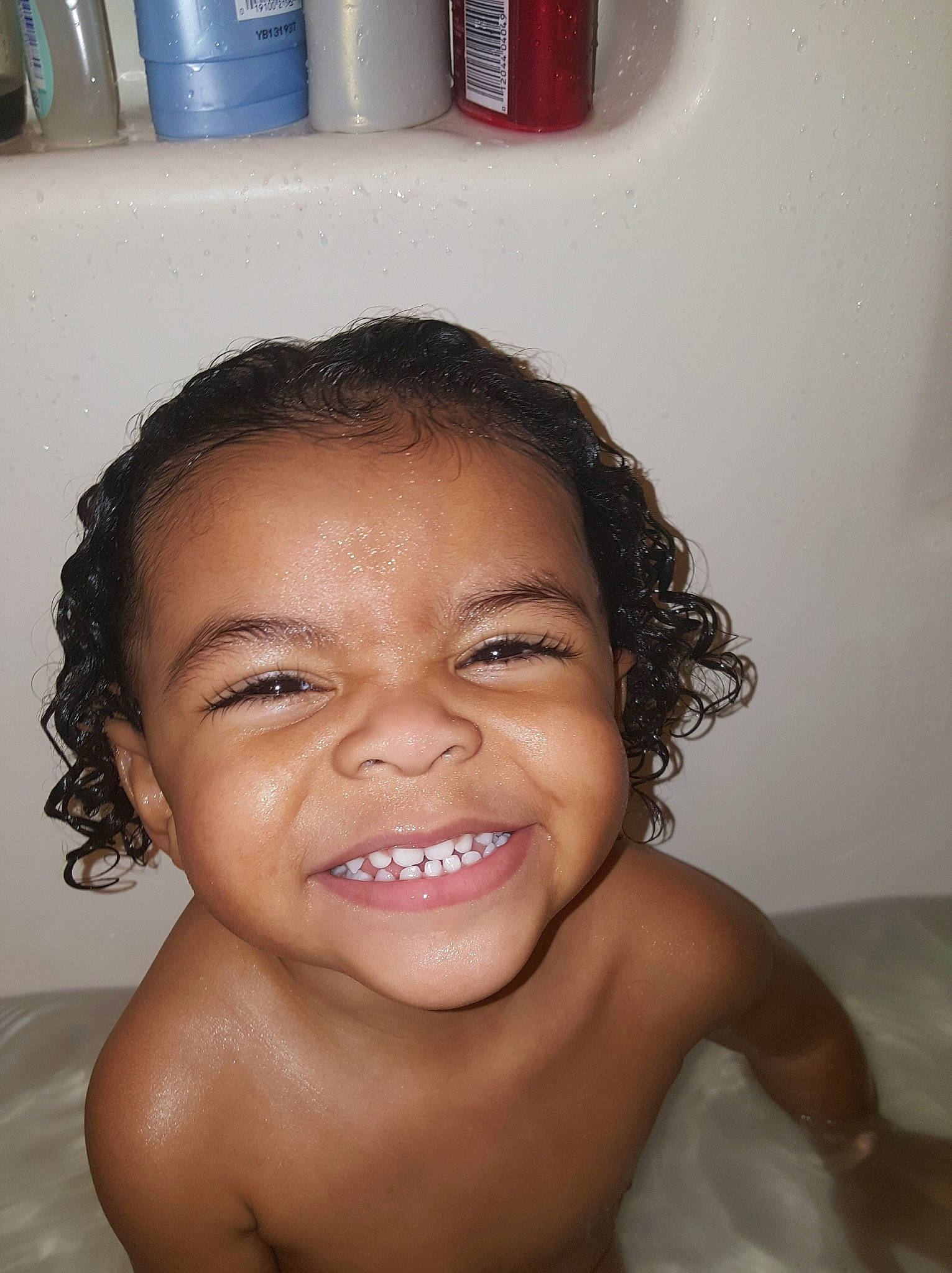 Avi is registered to the contest to win money with this photo: baby_bathing, bathing, cheek, child, chin, eyebrow, face, facial_expression, forehead, fun, hair, happy, head, joy, lip, mouth, neck, nose, person, skin