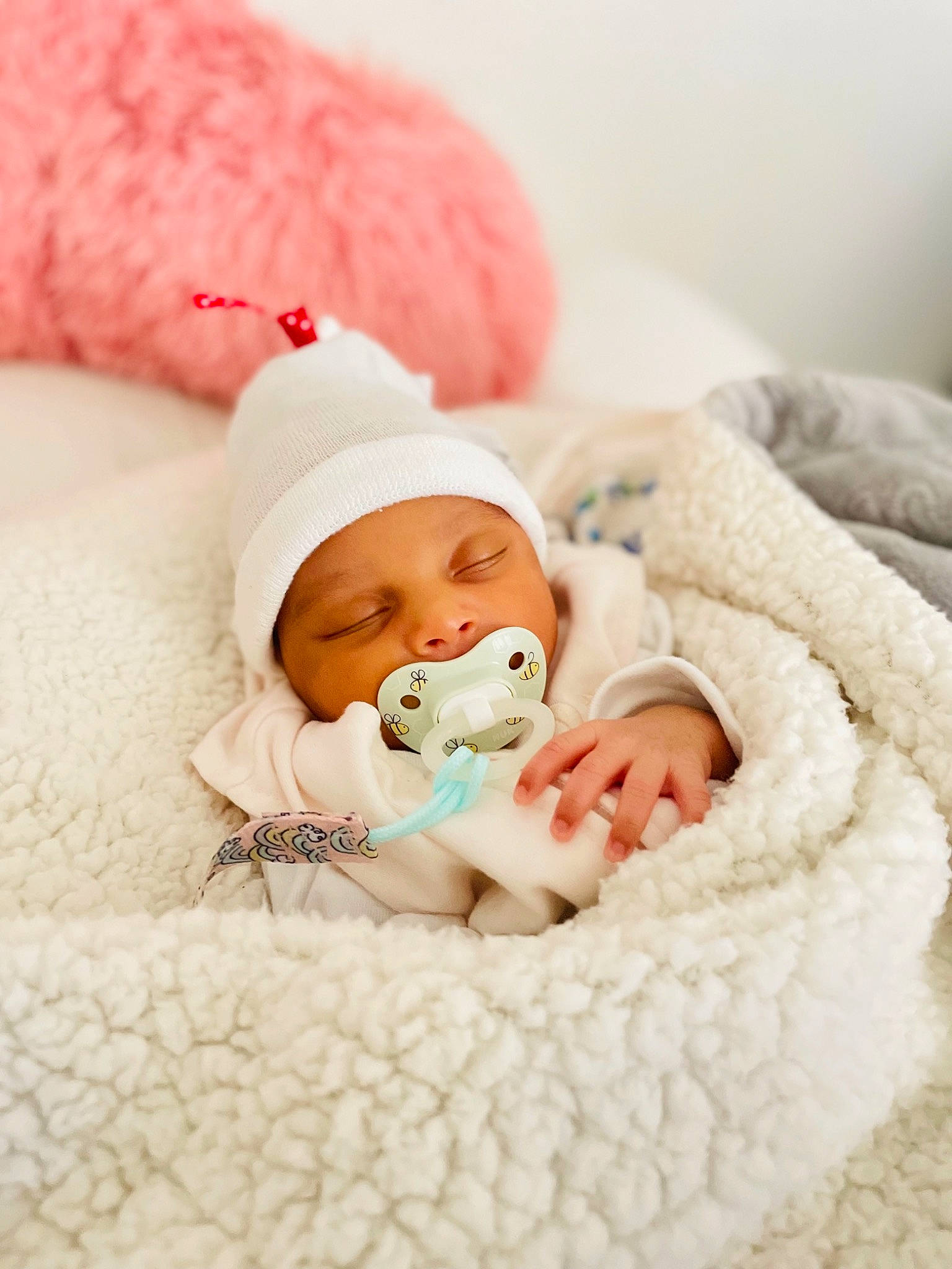 Alicia joined the competition — help win amazing prizes! baby, baby_sleeping, baby_toddler_clothing, bedding, bedtime, cap, cheek, child, comfort, fur, happy, headgear, headwear, knit_cap, linens, person, pink, product, skin, textile