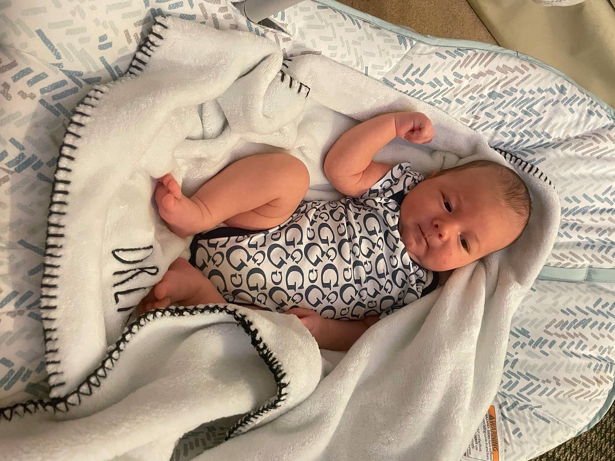 Christopher is registered to the contest to win money with this photo: arm, art, baby, baby_sleeping, baby_toddler_clothing, bedding, bedtime, child, comfort, finger, hand, headgear, leg, linens, mammal, pattern, person, skin, textile, thigh