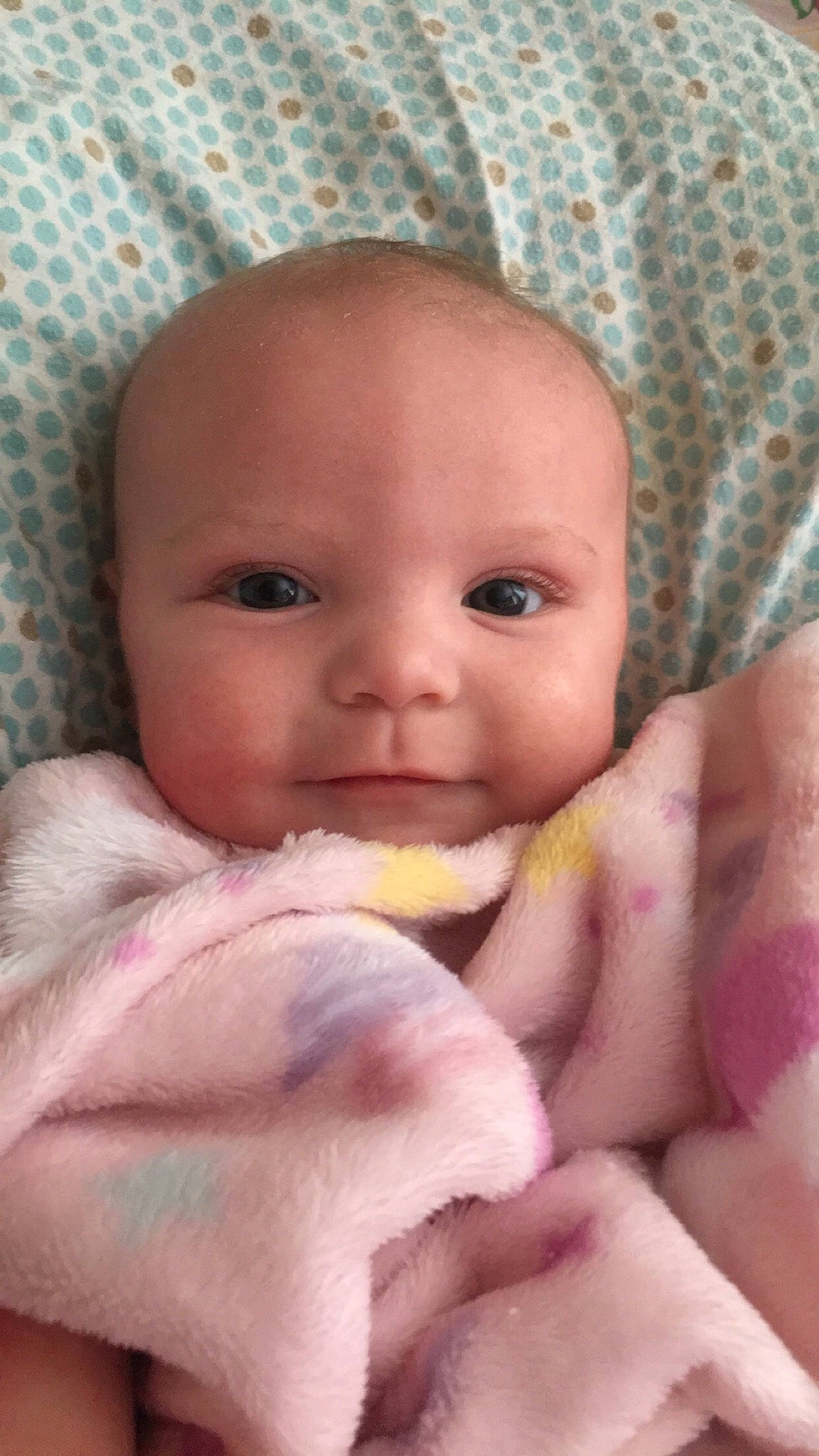 Rylynn is registered to the contest to win money with this photo: arm, baby, baby_toddler_clothing, cheek, chin, comfort, eye, eyelash, finger, gesture, hand, iris, lip, mouth, nose, person, pink, product, skin, textile