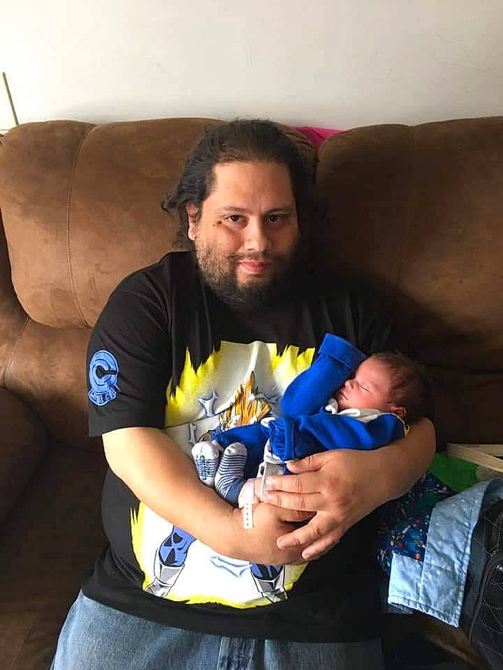 Angel is registered to the contest to win money with this photo: arm, beard, comfort, couch, elbow, eye, finger, hair, hairstyle, happy, head, human_body, joy, lap, mouth, muscle, person, shorts, shoulder, t_shirt