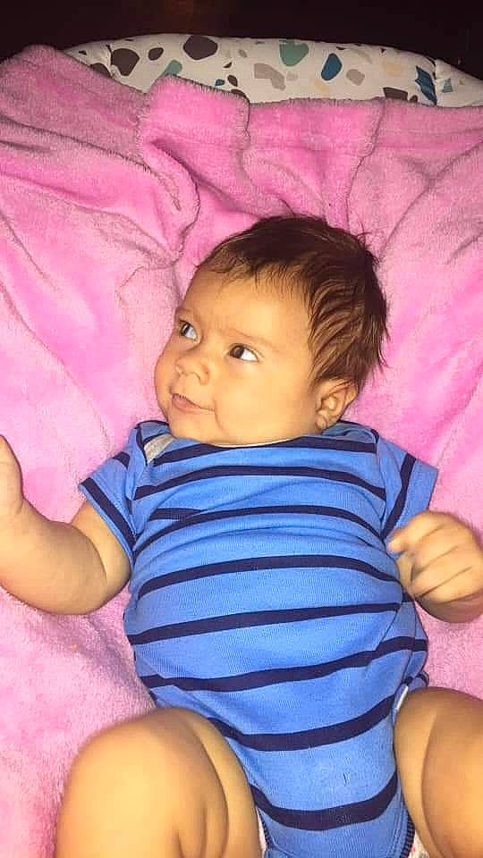 Angel is registered to the contest to win money with this photo: arm, baby_toddler_clothing, cheek, chin, comfort, eye, eyebrow, facial_expression, hair, head, iris, lip, mouth, nose, organ, person, product, purple, skin, textile