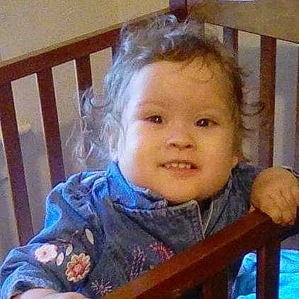 Yolanda is registered to the contest to win money with this photo: baby_toddler_clothing, blond, chair, cheek, child, ear, eye, eyebrow, face, food, fun, hair, happy, iris, joy, mouth, nose, person, sitting, smile