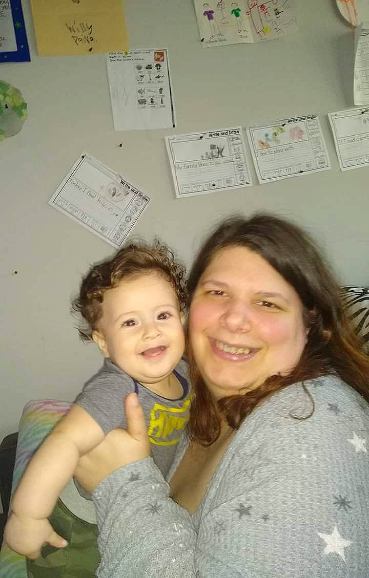 Joseph is registered to the contest to win money with this photo: cheek, child, community, design, event, facial_expression, fun, gesture, hairstyle, happy, hug, iris, joy, person, room, sitting, skin, smile, social_group, t_shirt