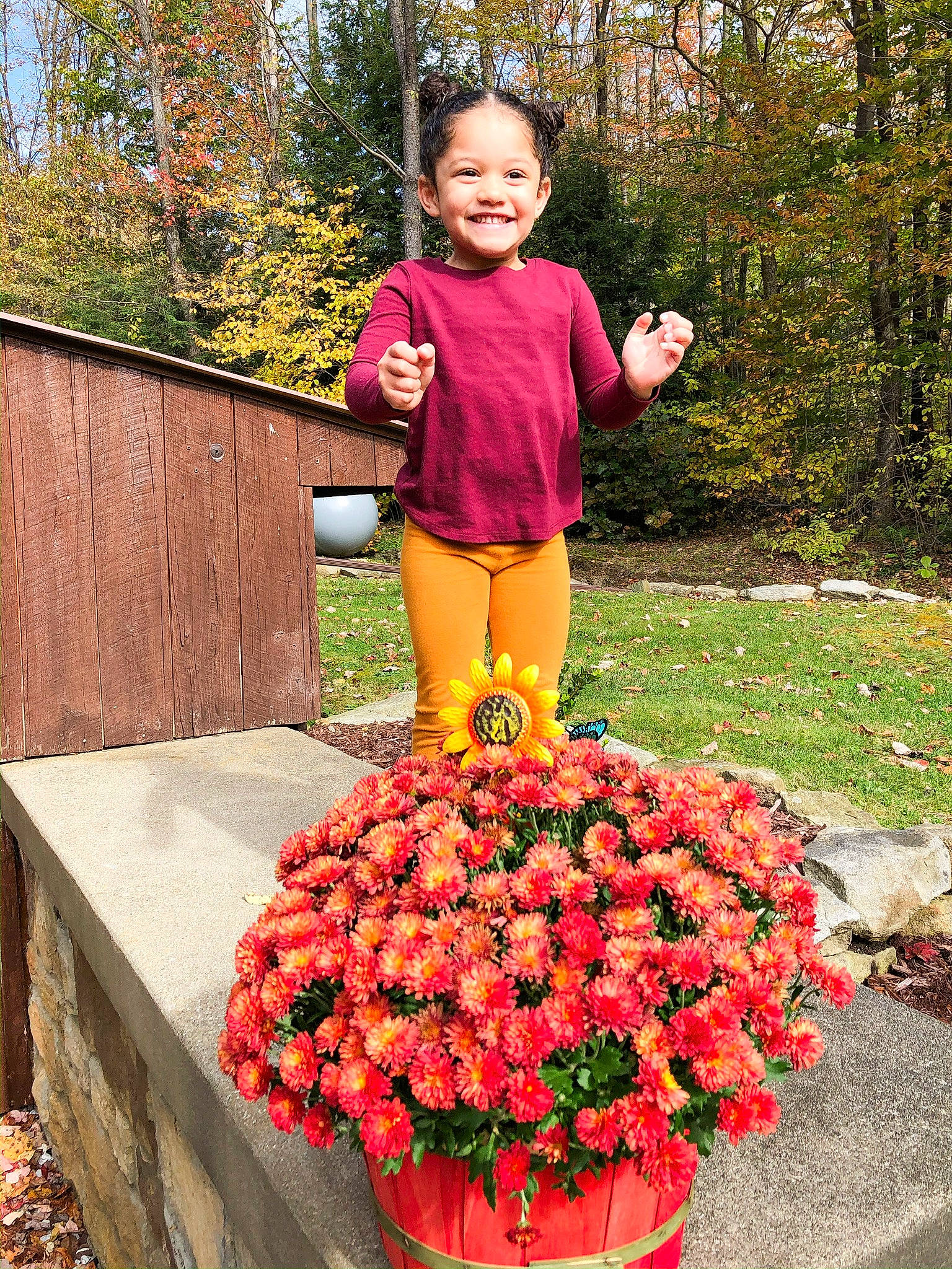 Mckenna joined the competition — help win amazing prizes! annual_plant, floristry, flower, flower_arranging, flowering_plant, flowerpot, grass, groundcover, happy, joy, landscaping, leaf, orange, people_in_nature, person, petal, plant, red, shrub, smile