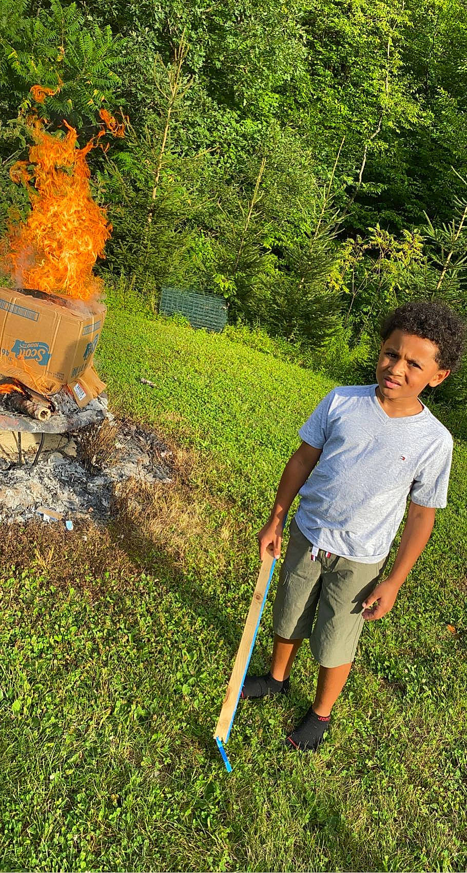 Tre is registered to the contest to win money with this photo: botany, conifer, evergreen, garden, grass, grass_family, grassland, groundcover, landscape, landscaping, lawn, leisure, natural_landscape, people_in_nature, person, plant, shorts, shrub, soil, tree