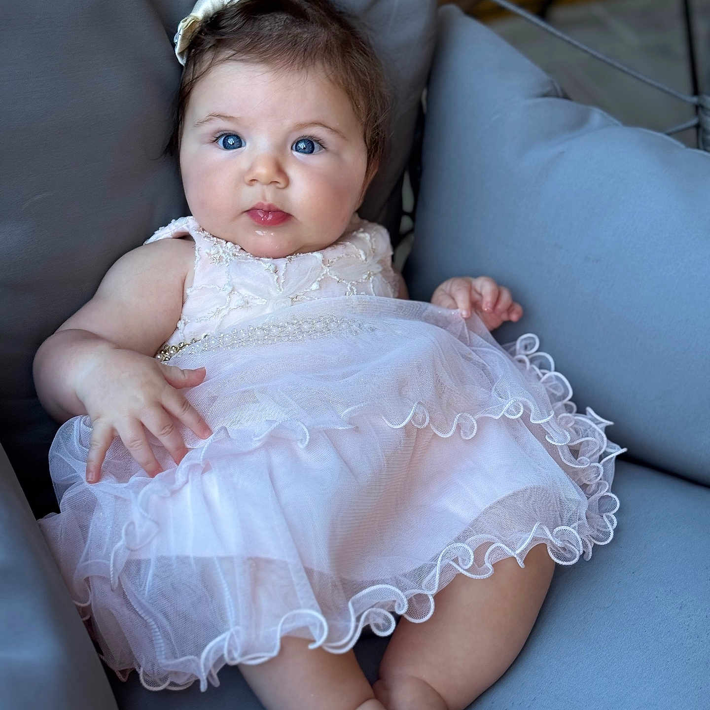 Sarah is registered to the contest to win money with this photo: adorable, baby, blue_eyes, bow, child, couch, cute, dress, foot, furniture, hand, indoors, infant, pink_dress, portrait, sitting, skin, smiling, soft, young_child
