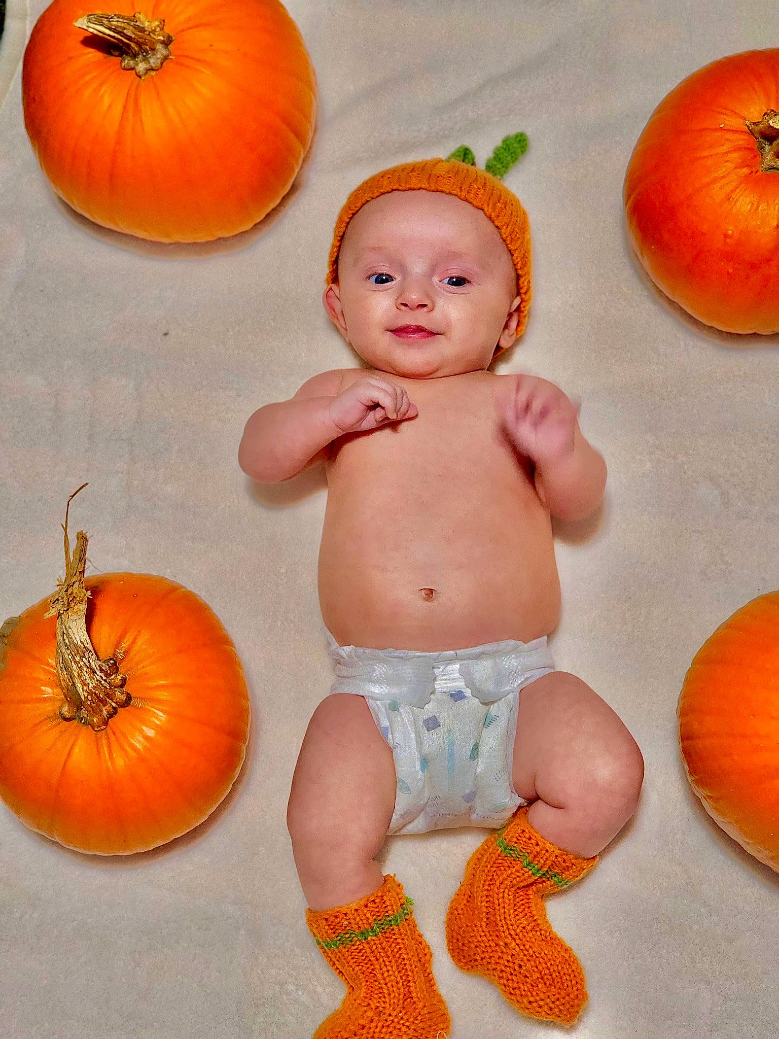 Rowen joined the competition — help win amazing prizes! baby, baby_toddler_clothing, calabaza, chest, child, cucurbita, facial_expression, gourd, happy, local_food, natural_foods, orange, organ, peach, person, produce, pumpkin, squash, stomach, vegetable
