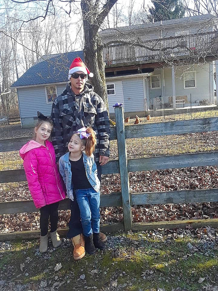 Maryah is registered to the contest to win money with this photo: child, family, headwear, joy, person, plant, play, sky, smile, snow, tourism, tree, winter