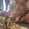 Valetina joined the competition — help win amazing prizes! calico_cat, carpet, casual_clothing, cat, curtains, ear, face, fur, home, indoor, light, lying_down, necklace, pet, relaxed, smiling, stretching, whiskers, window, woman