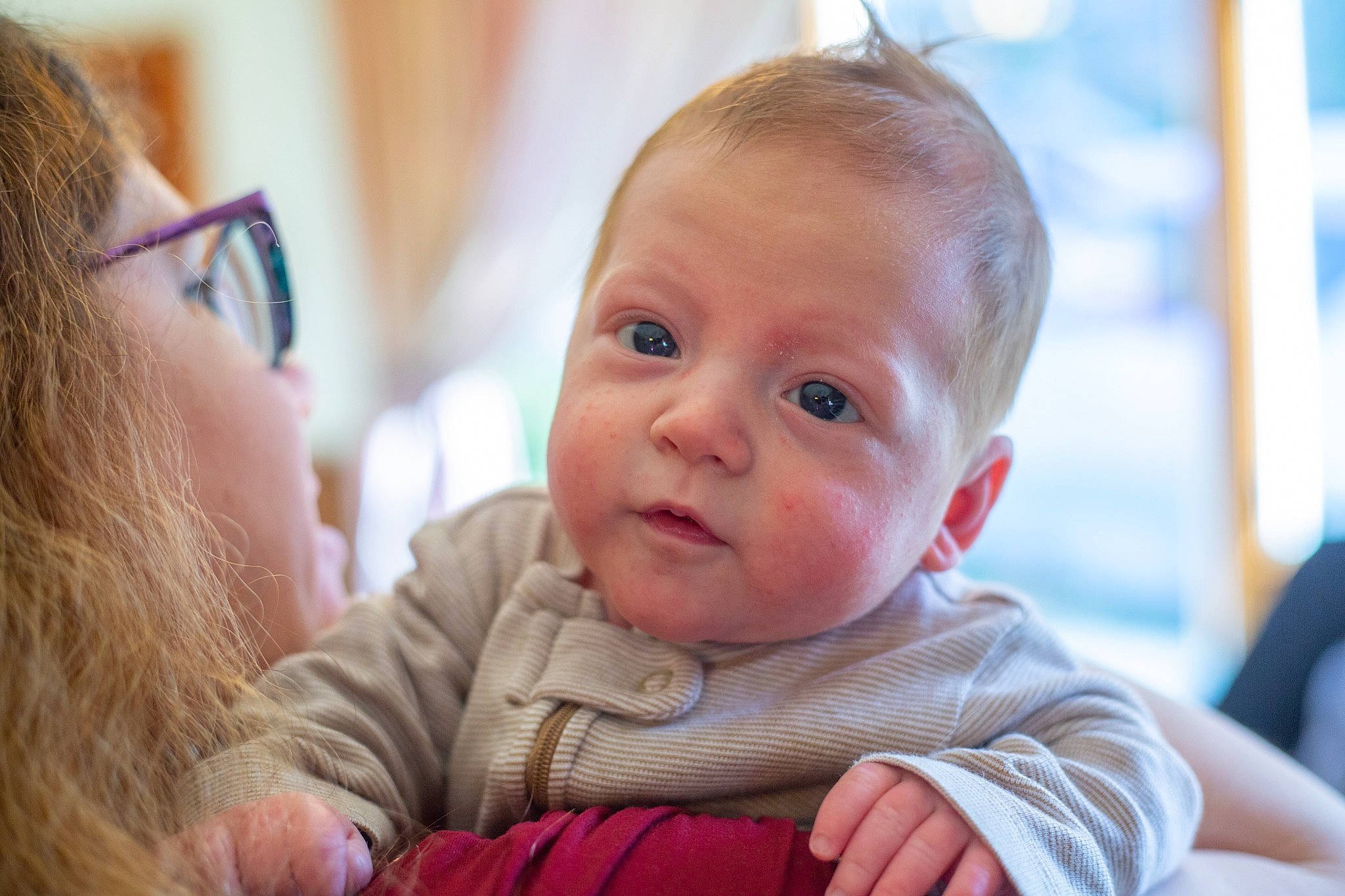 Desmond is registered to the contest to win money with this photo: baby, baby_toddler_clothing, cheek, child, chin, comfort, ear, event, finger, fun, gesture, happy, iris, leisure, nose, person, room, sitting, skin, toddler