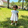 background_blur, blue_eyes, child, cute, daylight, grass, greenery, house, nature, outdoor, person, portrait, shoes, smiling, standing, sunny, toddler, trees, white_dress, young_child